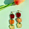 pair of bell pepper earrings in red, orange and yellow tiered