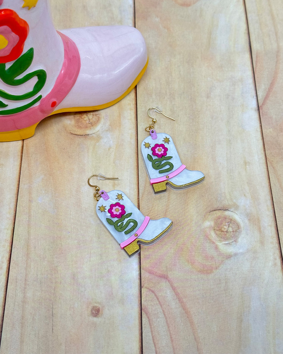 white pearl cowboy boot earrings with pink flowers and colorful glittery accents