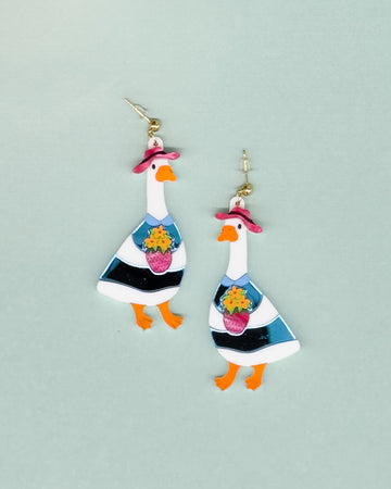 dangle earrings with a goose in a pink hat holding a bouquet of flowers in the ban.do strawberry vase