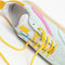 up close of aqua sneaker with yellow and hot pink trim detail and yellow shoe laces