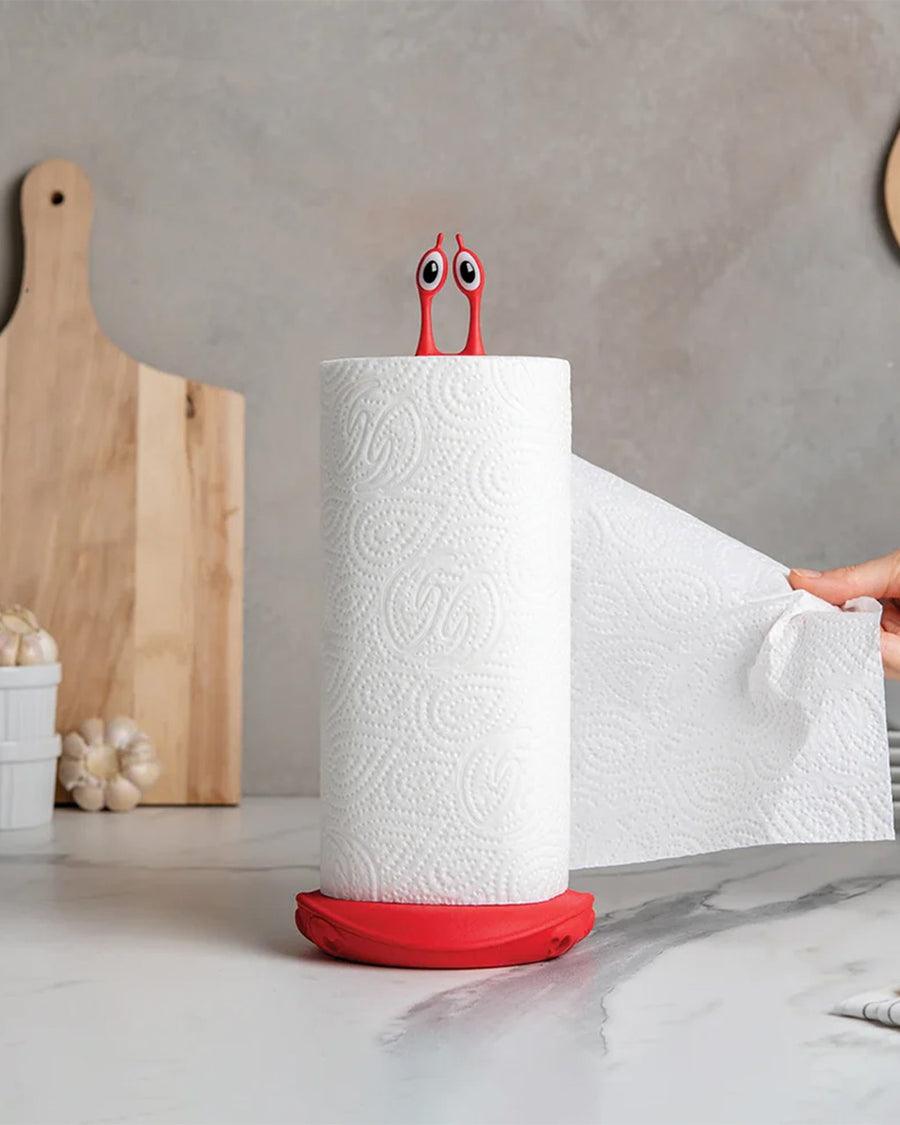 red crab paper towel holder with a roll of paper towels on it