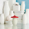 red and white mushroom fridge odor absorber on a table