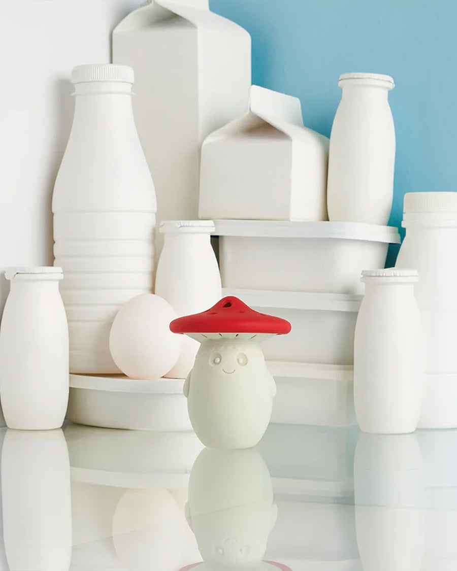 red and white mushroom fridge odor absorber on a table