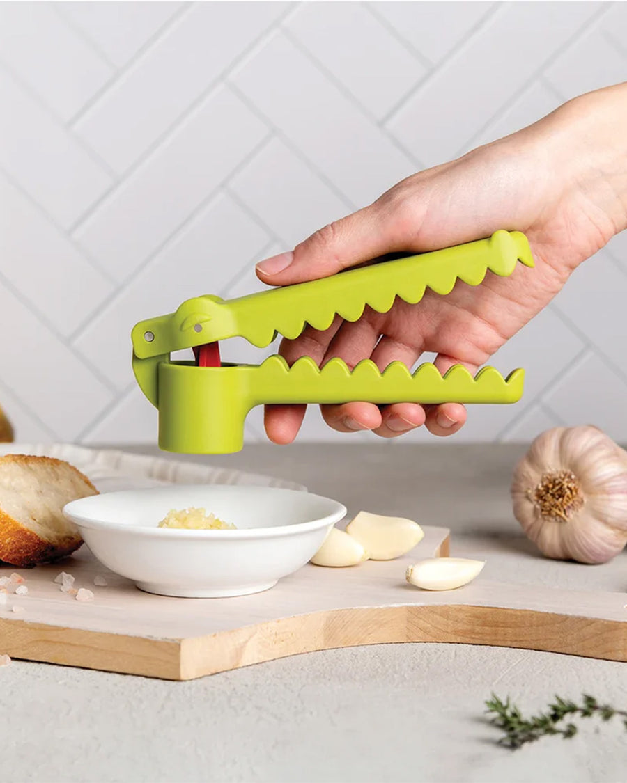 model using green crocodile garlic press