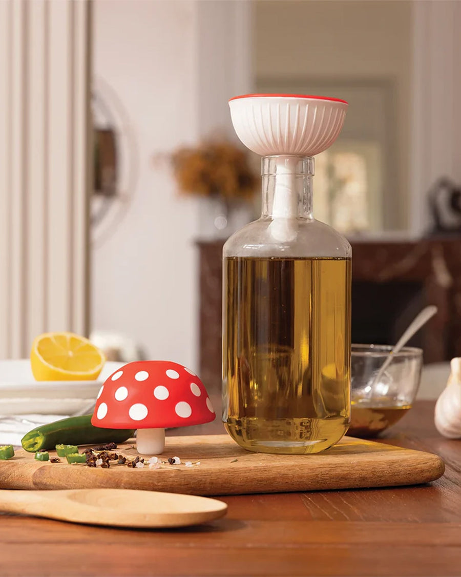 silicone red mushroom funnel on a table