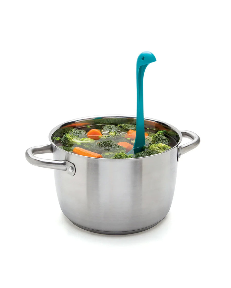 teal nessie ladle with leg shaped stand in a pot