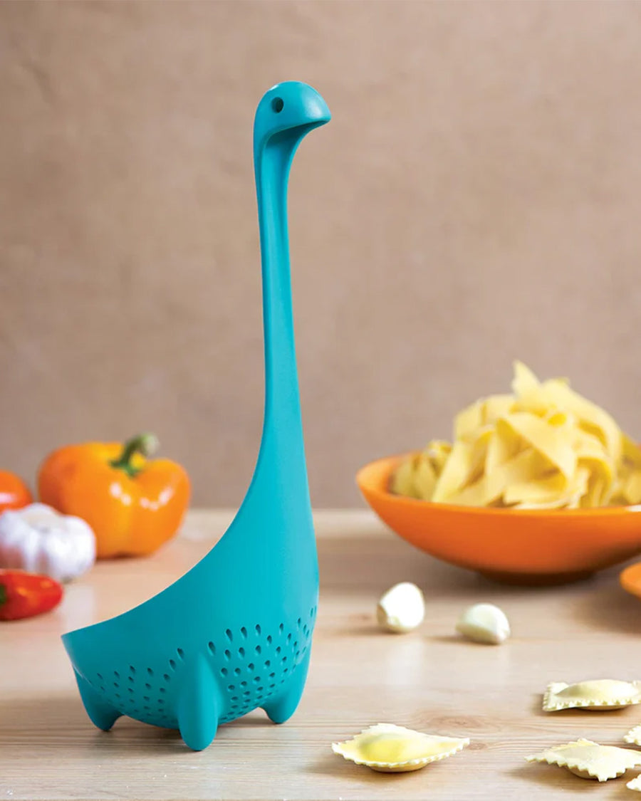 teal nessie ladle with leg shaped stand