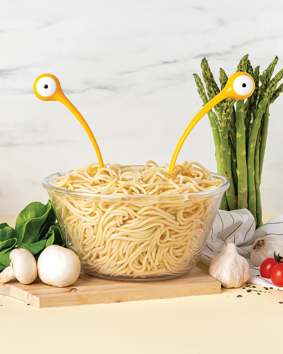 yellow monster pasta server utensils in pasta