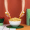 model using yellow monster pasta server utensils