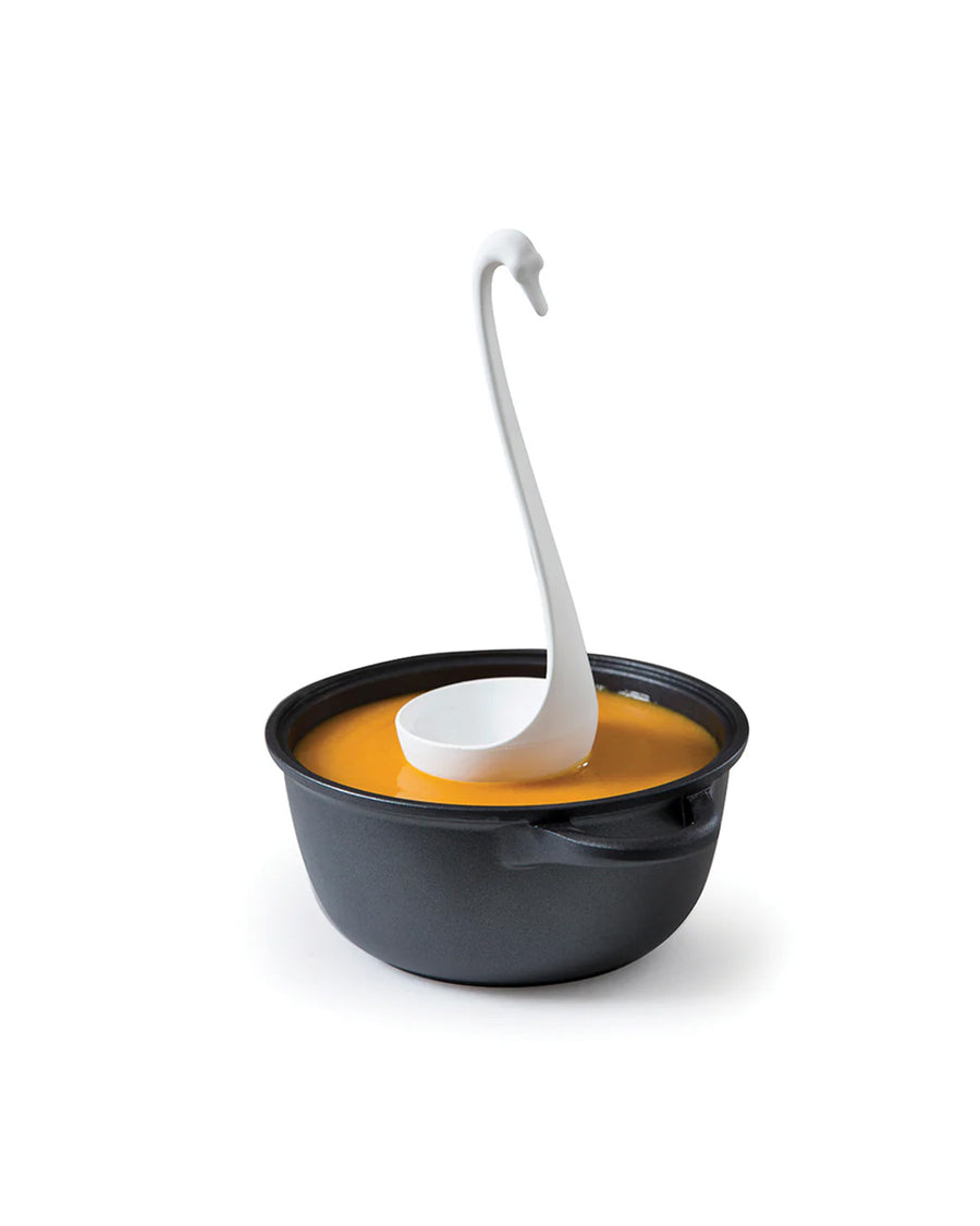 white swan floating ladle in a bowl