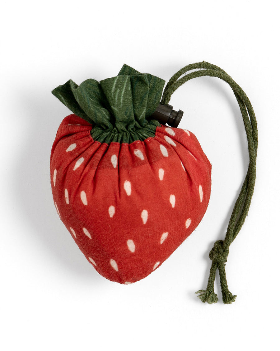 packed red gingham market bag with red strap and strawberry bag