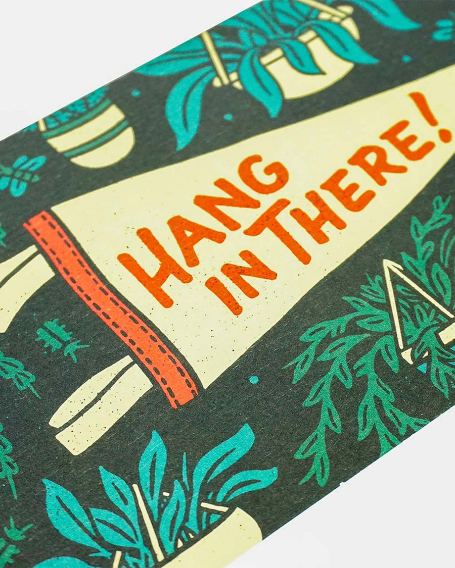 up close of 'hang in there' card and pennant