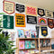 yellow wool flag with orange banner and black 'lost & found & lost again' hanging on a wall