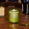 smoky cinnamon special soy standard candle on a table surrounded by confetti