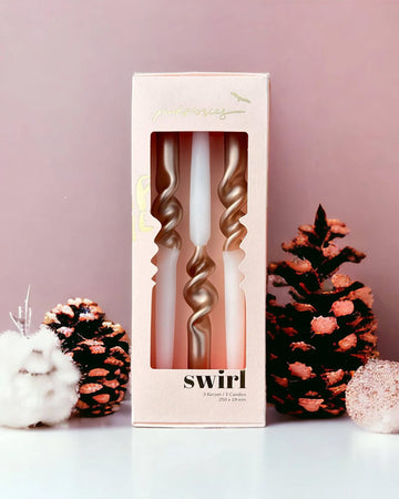 set of three twist taper candles that are half white and half metallic rose gold