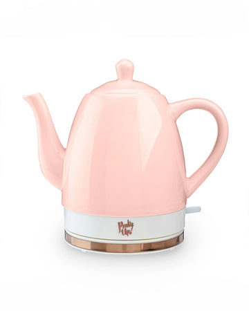 pink ceramic electric tea kettle off of rose gold base