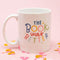 white ceramic mug with colorful 'the book was better' across the front surrounded by confetti