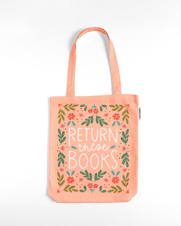 pink tote bag with floral print and 'return these books' across the front