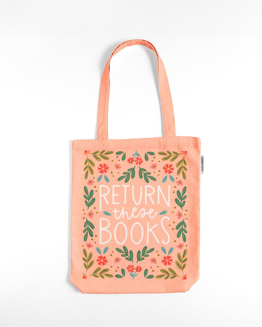 pink tote bag with floral print and 'return these books' across the front