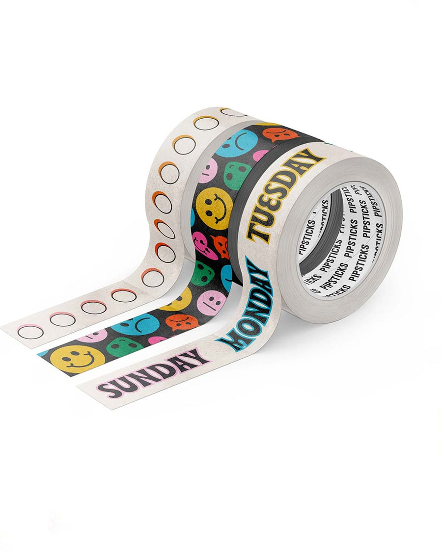 Three rolls of decorative washi tape: 15mm x 10m roll of Any Day Now Washi 15mm x 10m roll of Mixed Emojis Washi 15mm x 10m roll of Radio Button Rainbow Washi