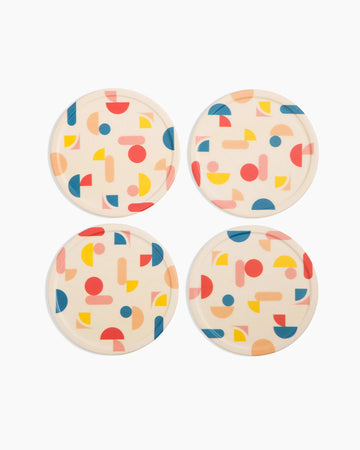 cream set of 4 coasters with colorful all over geometric shapes