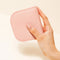 model holding pink dome wallet