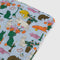 light blue puffy picnic blanket with colorful table cats print