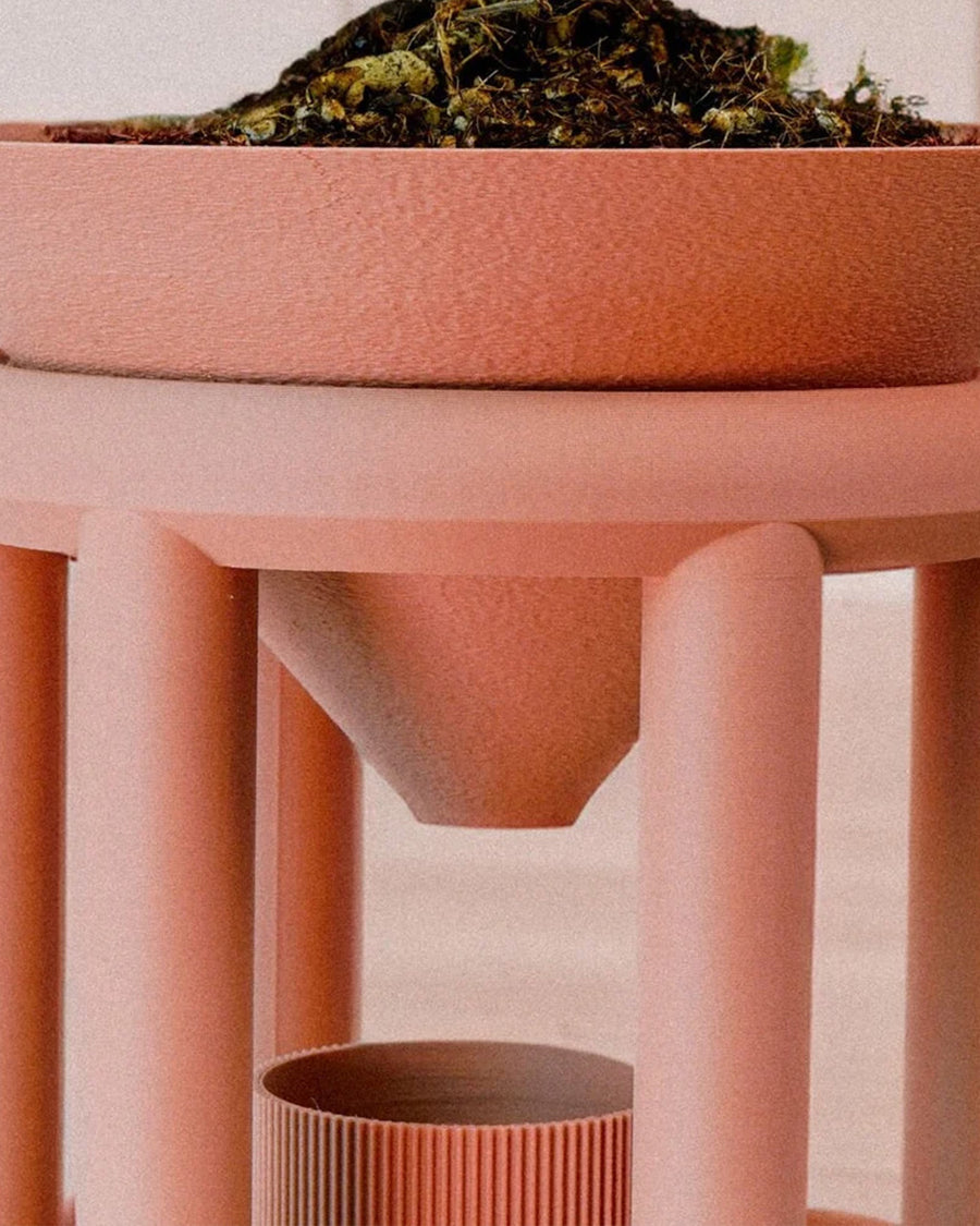 up close of copper colored 3d printing planter with drip tray