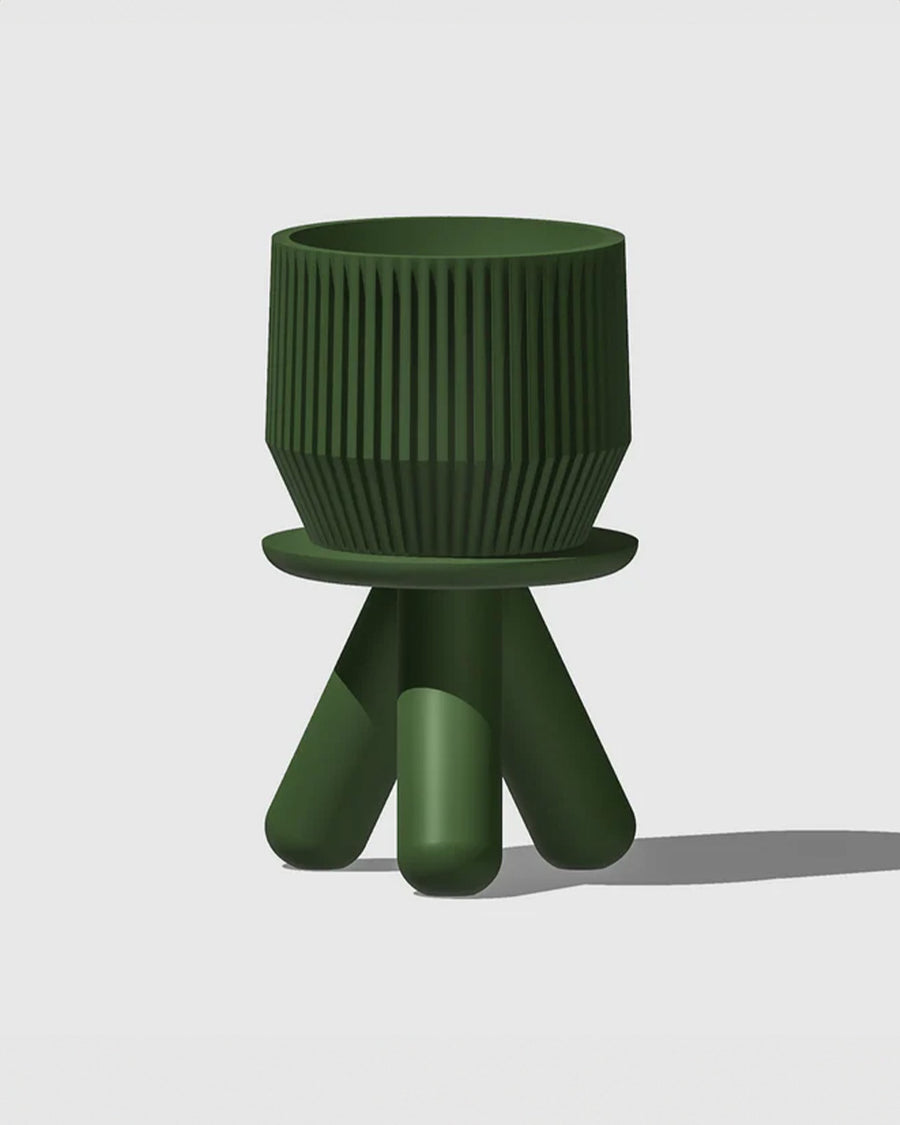 green 3d printed 6 in. plant stand with planter on it