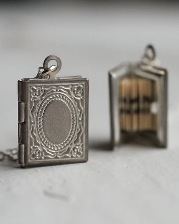 silver book shaped locket