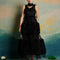 model wearing black tulle midi dress with tufted tulle layers