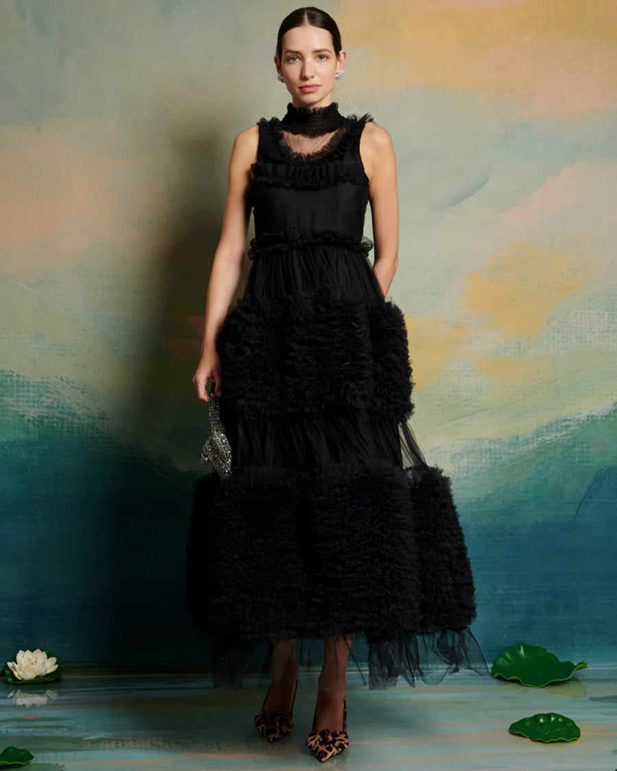 model wearing black tulle midi dress with tufted tulle layers