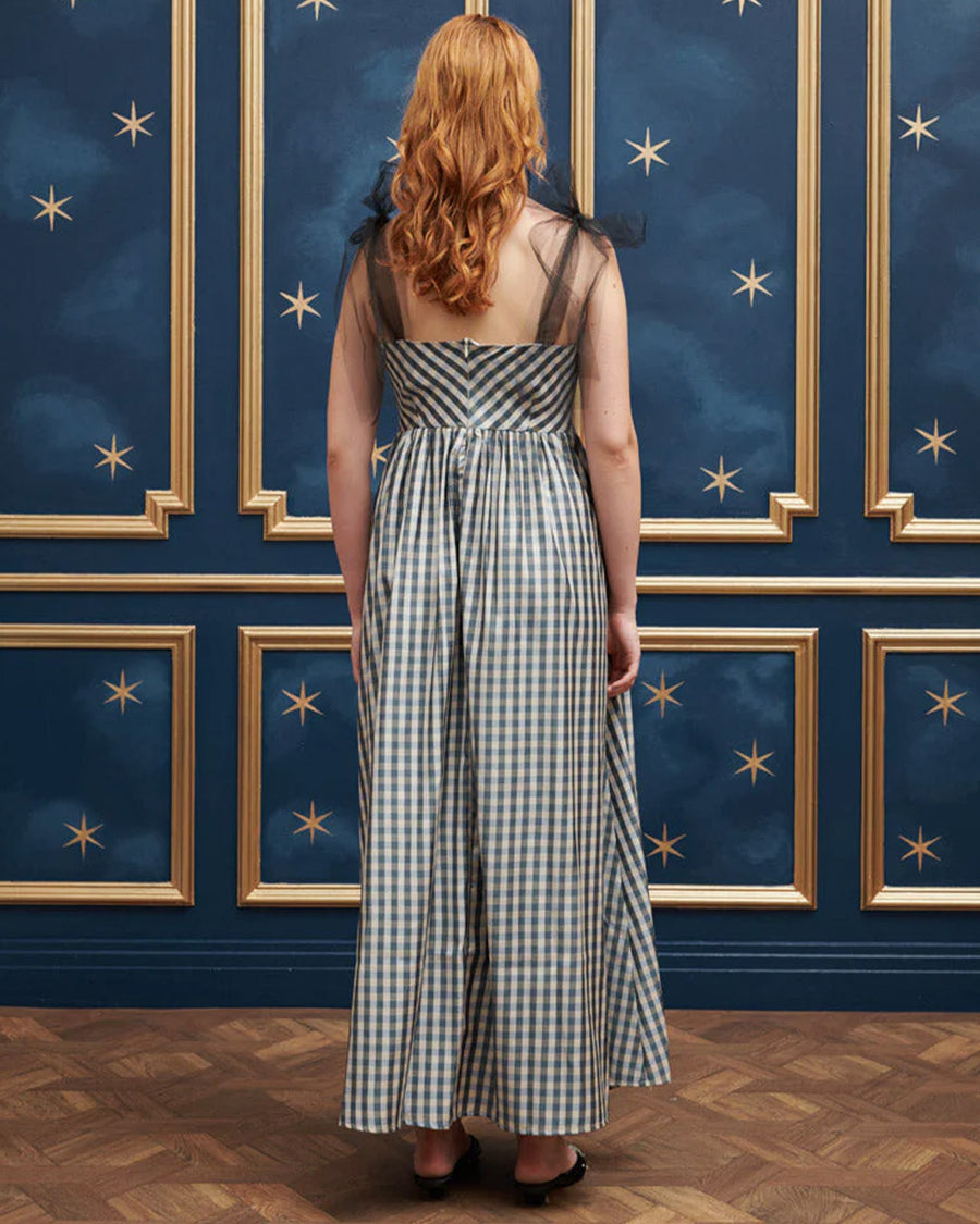 back view of model wearing blue and white checkered dress with tulle straps