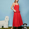 model wearing red midi dress with bows on the waist