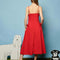 back view of model wearing red midi dress with bows on the waist