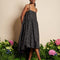 model wearing black bubble hem midi dress with delicate pink flowers and open back