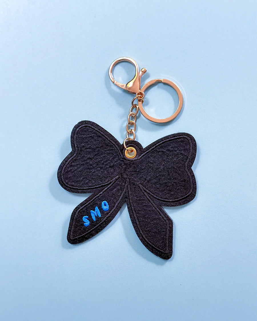 black back keychain with oversized red chenille bow