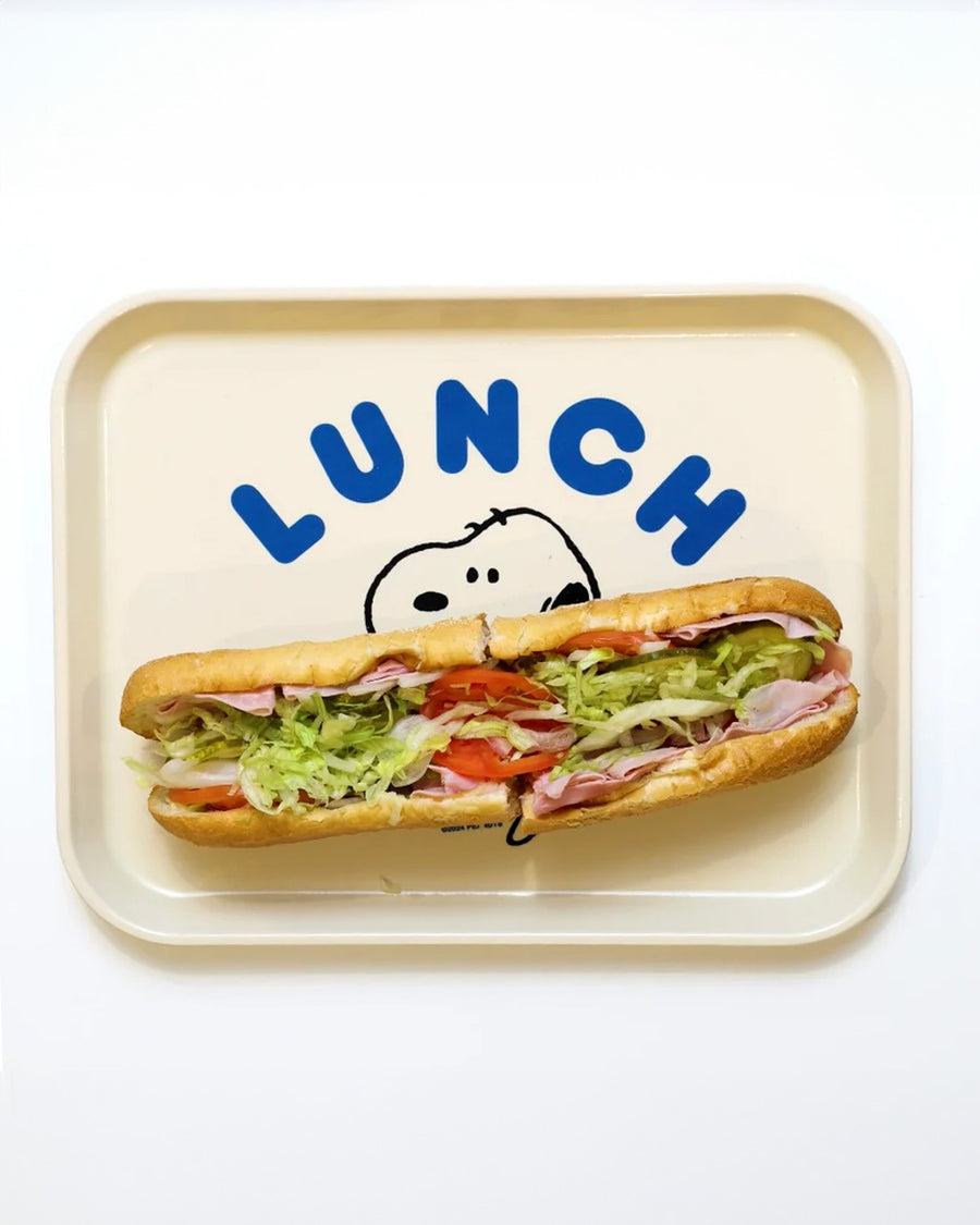 white rectangular tray with blue 'LUNCH' and snoopy holding a big sandwich with a sub on it