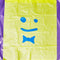 flat yellow trash bags with blue smiley face print