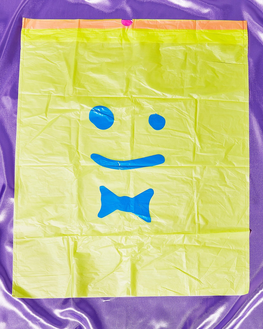 flat yellow trash bags with blue smiley face print