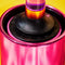 up close of hot pink metallic lint roller and green smiley top holder