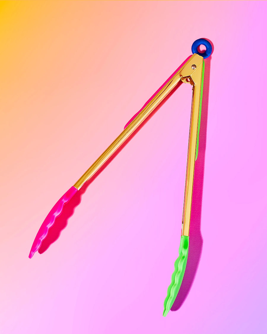 gold tongs with pink and green silicone bottoms