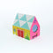 side view of colorful tipped matches in a colorful house shaped box