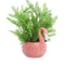 flamingo planter with plant inside