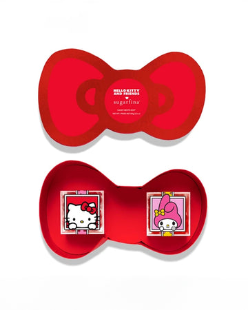 opened 2 piece candy set in a red hello kitty bow box