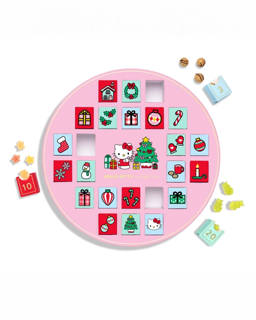 hello kitty 24 day candy advent calendar with candy scattered around it