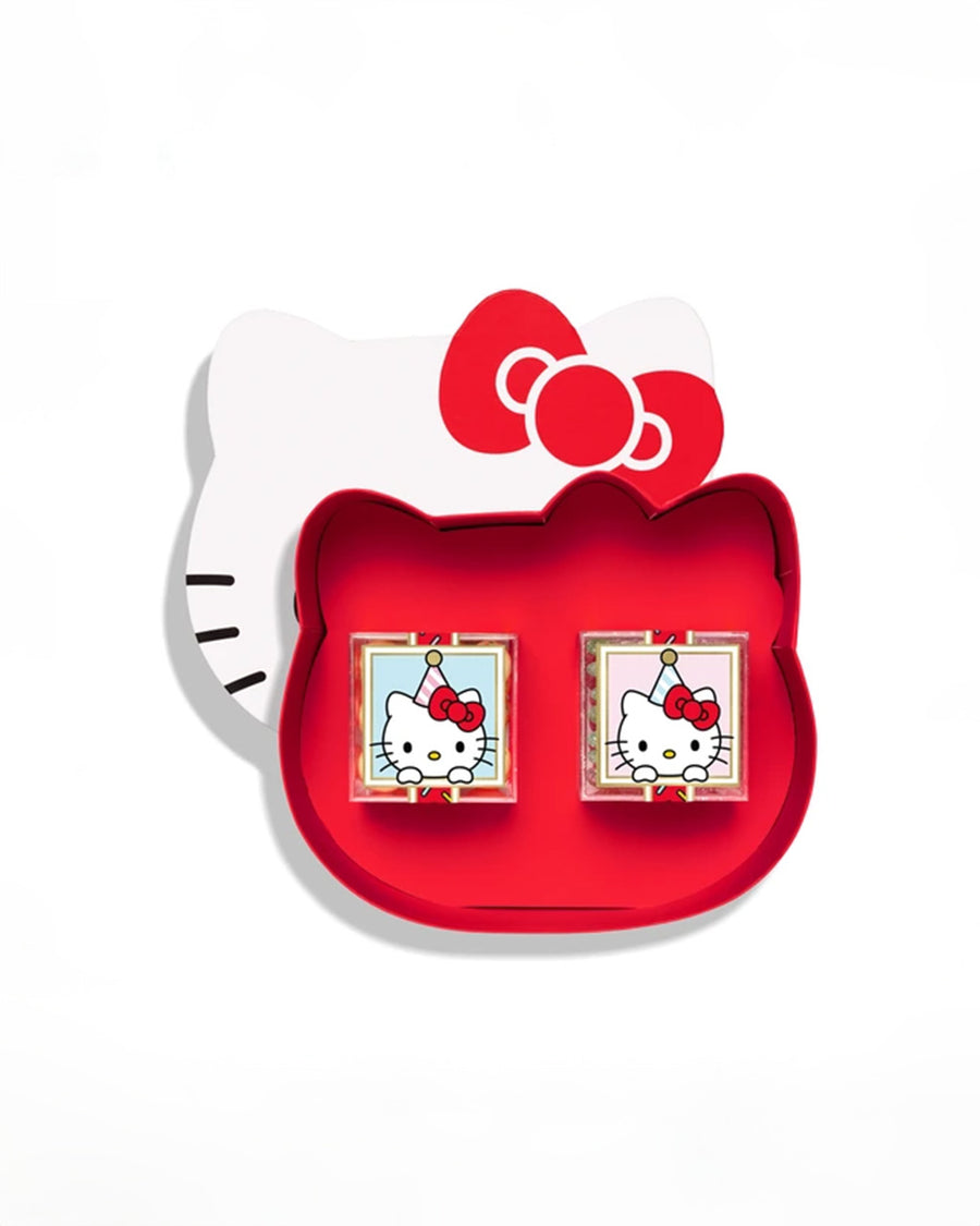 opened set of 2 candy pieces in a hello kitty face shaped box