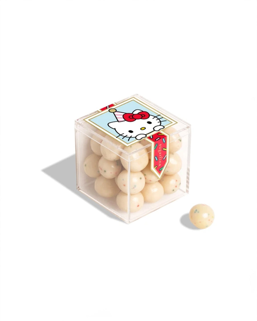 cream hard shell chocolates in a clear plastic container