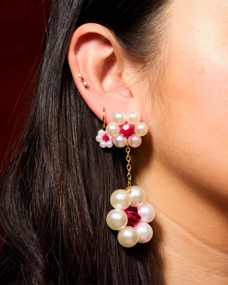 model wearing beaded white daisy two tiered dangle earrings