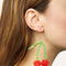 model wearing beaded cherry dangle earrings
